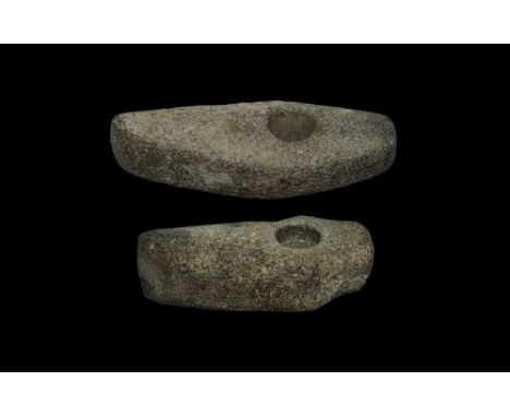 Neolithic, 4th-2nd millennium BC.
A pair of ground diorite axeheads, each with median swelling, round mounting hole, square-s