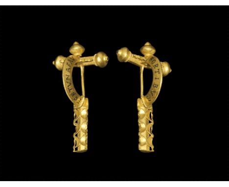 4th century AD. 
A gold crossbow brooch with hollow hexagonal-section crossbar, three onion-shaped bulbs, openwork scrolled p