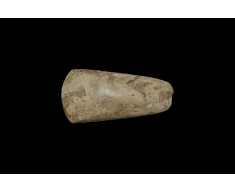 Neolithic, 5th-4th millennium BC. 
A finely polished axe with oval section, tapered sides, rounded butt and convex cutting ed