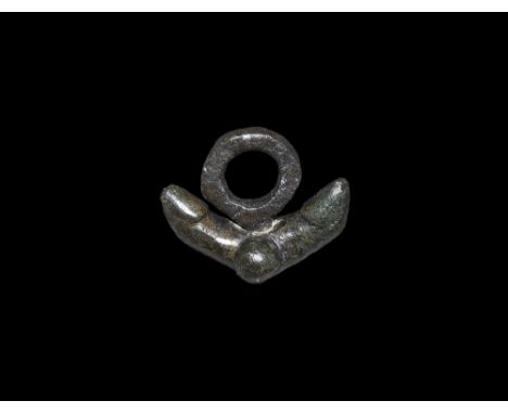 1st-2nd century AD.
A bronze pendant with two phalloi and testes below a thick suspension ring. 16 grams, 29mm (1 1/4"). Very