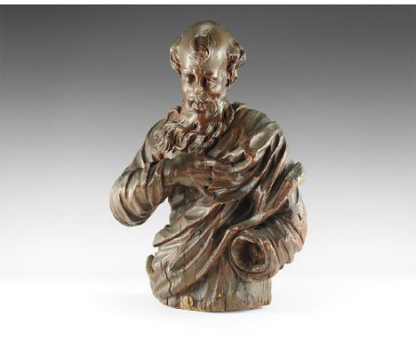 17th century AD. 
A carved wooden architectural figure, St Benedict (?), a bearded monk with tonsured hair looking downwards,