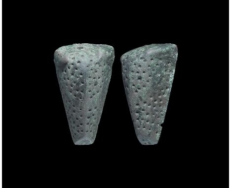10th-11th century AD.
A convex boar-head brooch with carinated upper face with rows of impressed dots, round-section posts to