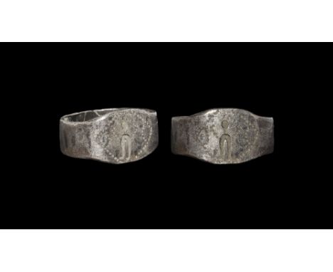 3rd century AD.
A flat-section silver hoop with expanding shoulders, plaque with stamped standing figure and pointille frame 