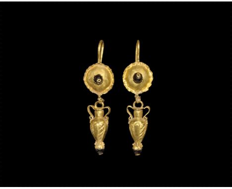 2nd-3rd century AD. 
A matched pair of gold earrings, each a hook with granule, domed plaque with crimped edge and inset garn