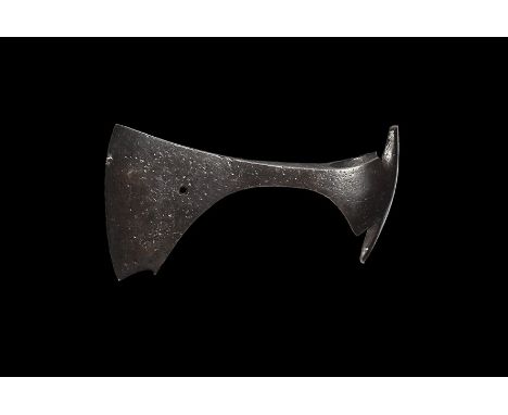 9th-11th century AD. 
An iron axehead with triangular-section blade, narrow neck widening to a broad bevelled edge with squar