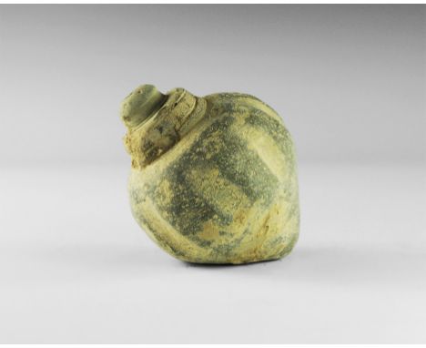 9th-11th century AD. 
A hollow ceramic vessel with a thick conical nozzle; vertical ribbing to the shoulders with rosette det