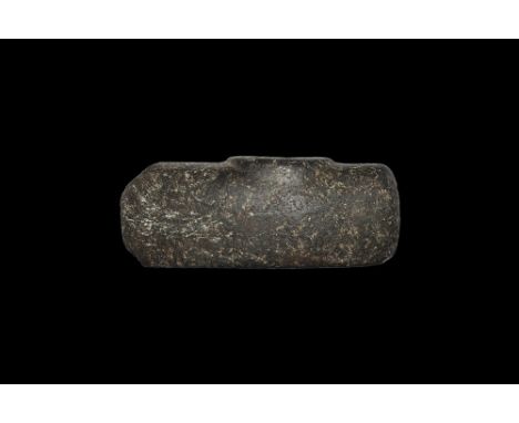 Neolithic, 5th-3rd millennium BC. 
A pecked and polished axe-hammer, pierced for hafting, the lower circumference of the pier