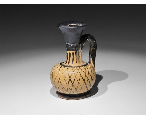 4th century BC.
A ceramic blackware lekythos of Magna Graecian (Gnathian) workmanship, the funicular neck with vertical block