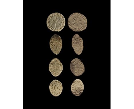 13th-14th century AD.
A mixed group of lead seal matrices comprising: one discoid with loop to the reverse, central intaglio 