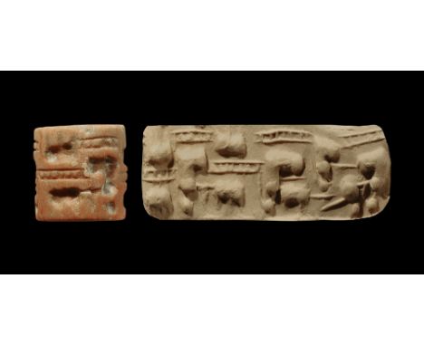 3rd millennium BC. 
A marble cylinder seal with scene of three women; accompanied by an old scholarly note, typed and signed 