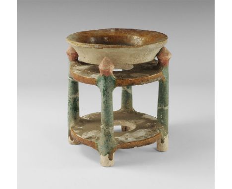 Ming Dynasty, 1368-1644 AD. 
A glazed ceramic shallow dish and stand with two annular plaques and four vertical posts with bi