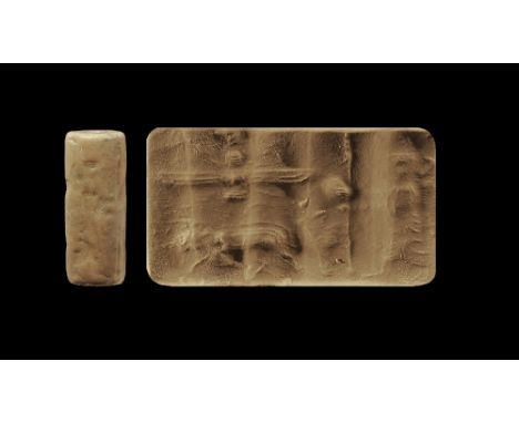 450-350 BC.
A limestone cylinder seal with royal figure, boar and solar disc; accompanied by an old scholarly note, typed and