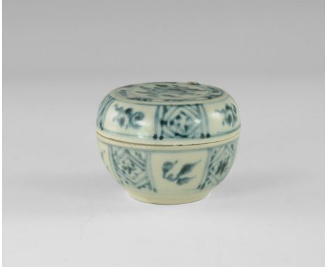Later 15th century AD. 
A squat white-glazed ceramic jar and lid with blue flower to the upper face, segmented sides with alt