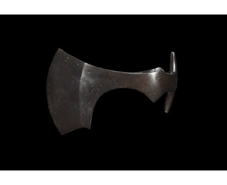 9th-11th century AD.
An iron axehead with triangular-section blade, narrow neck widening to a broad bevelled edge with square