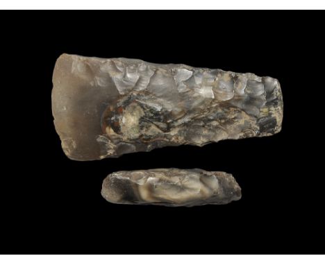 Neolithic, 6th-2nd millennium BC. Knapped and polished axehead with tapered squared sides and a chisel with near parallel squ