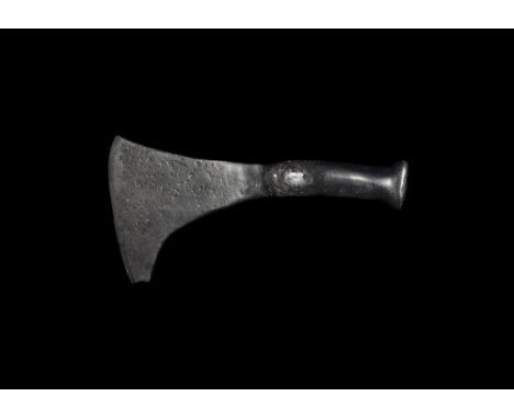 9th-12th century AD.
A small hand-forged iron axehead with curved blade and square chin, round-section hammer to the rear. 44