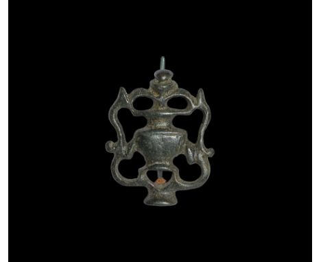 1st century AD.
A bronze plate brooch formed as a flask or jar modelled in low relief with La Tène-inspired tendrils surround