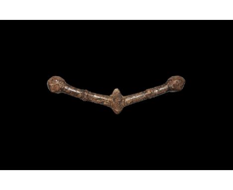 10th century AD.
An iron war hammer, formed as two round-section sloping arms with baluster detail to the middle, polyhedral 