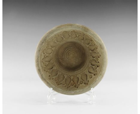 1st millennium AD. 
A ceramic mould for decorated bowls with deep central socket and concentric rings motif, band of tear-dro