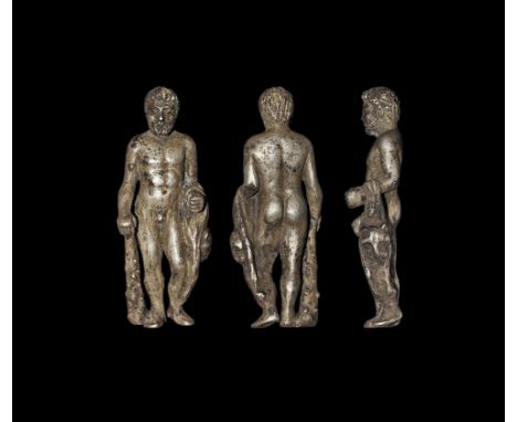 1st-2nd century AD. A silver figurine of bearded Hercules (Heracles) standing nude with right hand resting on the handle of h