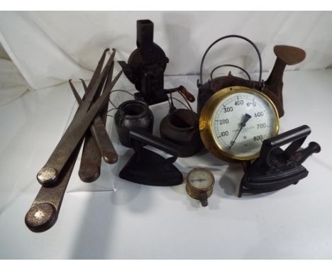 A good mixed lot of vintage metal tools to include three heavy smelting pots one marked Vedac, four calipers of various sizes