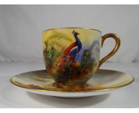 Royal Worcester - a miniature cup and saucer hand painted with peacocks - Est £65 - £95
