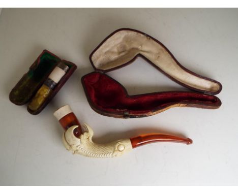 A cased Meerschaum novelty pipe in the form of a claw, and a cased cheroot holder with hallmarked Chester silver mounts - Est