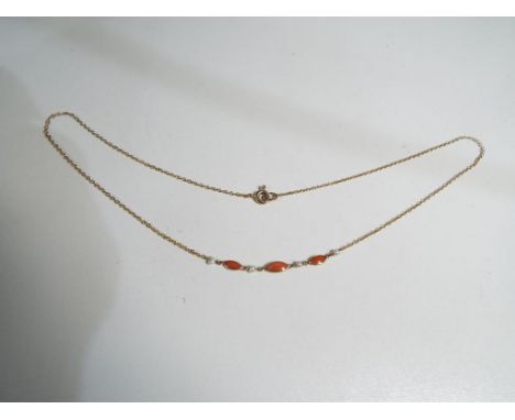 A lady's 9 carat gold coral and pearl necklace approx 38cms (l)