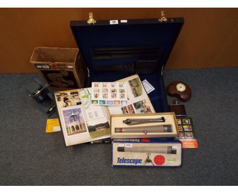 A good mixed lot to include an attaché case, a small collection of stamps, vintage telescope in original box and a battery op