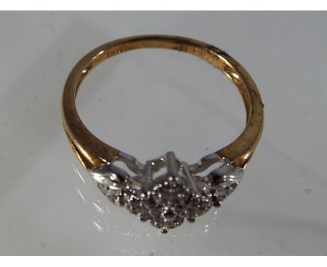 A lady's 9ct gold diamond cluster ring, size K, approximately 1.82 g all in. Est £25 - £35