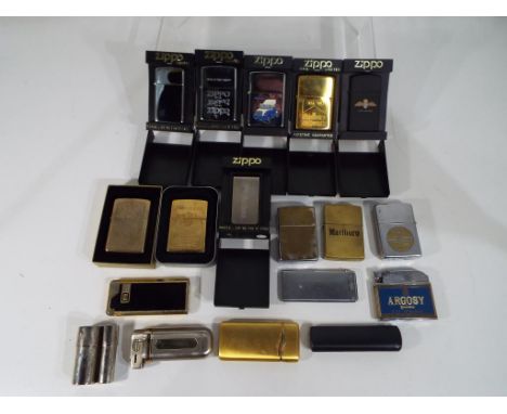 Seventeen cigarette lighters to include ten Zippo lighters predominantly in cases, a Roland lighter and similar, also include