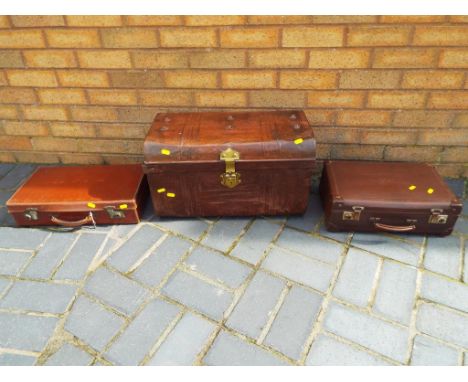 A small metal travelling trunk and 2 small vintage suitcases. (3)
