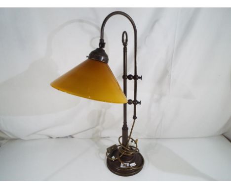 A good quality metal table lamp with amber coloured glass shade, height approx 63cms  Est £20 - £40