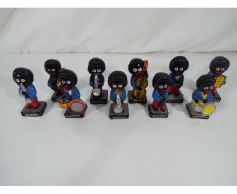 10 Robertsons advertising figures playing musical instruments.