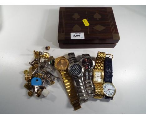 A good lot to include five wristwatches including Rotary, Ravel, Gianni Ricci and similar also included in the lot is a woode