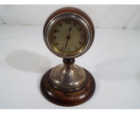 A hallmarked silver and oak mantel clock inscribed verso H.A.C. MAKE, Wurttemberg, silver hallmarked assay marks (unclear rub