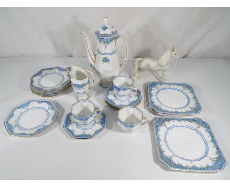 A Royal Doulton Arvon part tea service comprising coffee pot, milk jug, three cups, five saucers, six plates and three larger