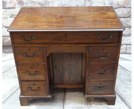 GEORGE III MAHOGANY KNEE-HOLE DESK, fitted frieze drawer above arrangement of six others around an concealed under arch drawe