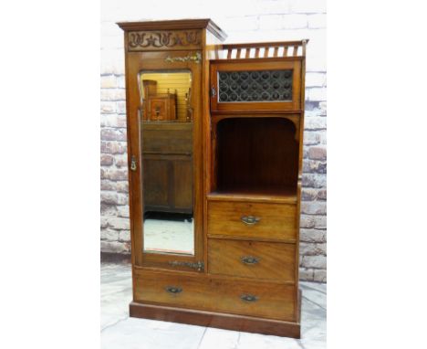 ARTS &amp; CRAFTS-STYLE MAHOGANY WARDROBE / COMPACTUM, with mirrored door, floral carved frieze, gilt brass strap hinges, lea