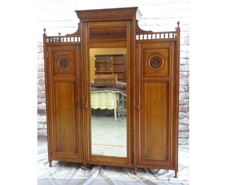 LATE VICTORIAN AESTHETIC-STYLE MAHOGANY TRIPLE WARDROBE / COMPACTUM, a foliate carved doors with gilt line detail, gilt brass