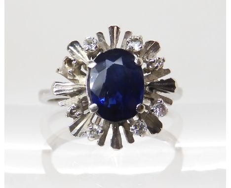 An 18ct white gold sapphire and diamond retro ring, size H1/2, weight 3.2gms Condition Report: Available upon request