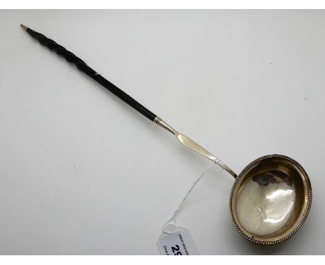 A white metal toddy ladle with whale bone handle, 40cm long Condition Report: Available upon request