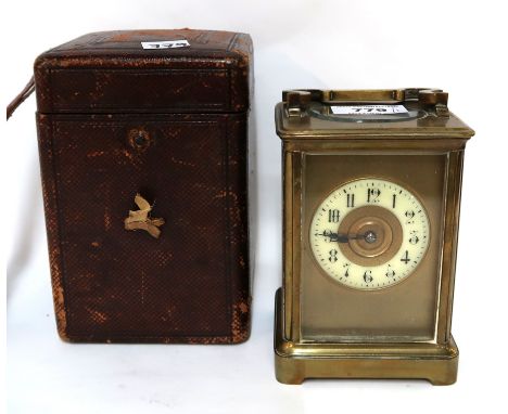 A brass and glass carriage clock with travelling case Condition Report: Available upon request