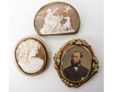 Two well carved shell cameos in gold plated mounts and a Victorian double sided yellow metal locket brooch Condition Report: 