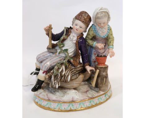 A Meissen figure of Winter, modelled as a boy seated upon a sledge holding an axe beside a girl warming her hands on a brazie