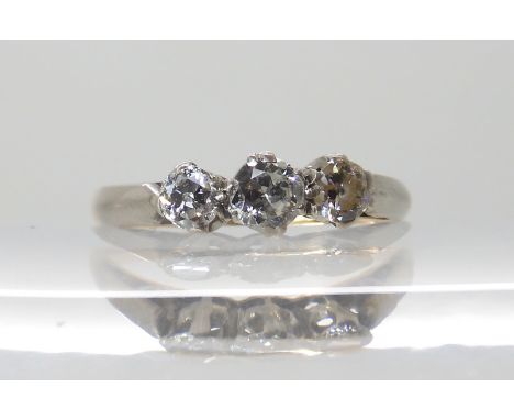 An 18ct gold three stone diamond ring of estimated approx 0.38cts combined, size N, weight 2.2gms Condition Report: Available