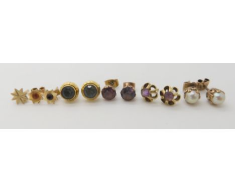 A collection of gold and yellow metal earrings to include amethyst pearl etc, combined weight 7.4gms Condition Report: Availa