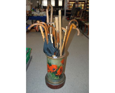 A collection of various walking canes etc in ceramic stick stand Condition Report: Available upon request