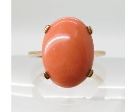 A 9ct gold coral ring, coral 16.2 x 11.9mm, finger size N1/2, weight 5gms Condition Report: Available upon request