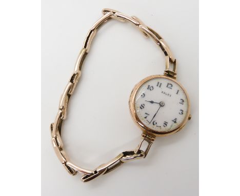 A 9ct gold ladies vintage Rolex with Glasgow import marks for 1924, diameter of the case 2.5cm with expandable strap, weight 